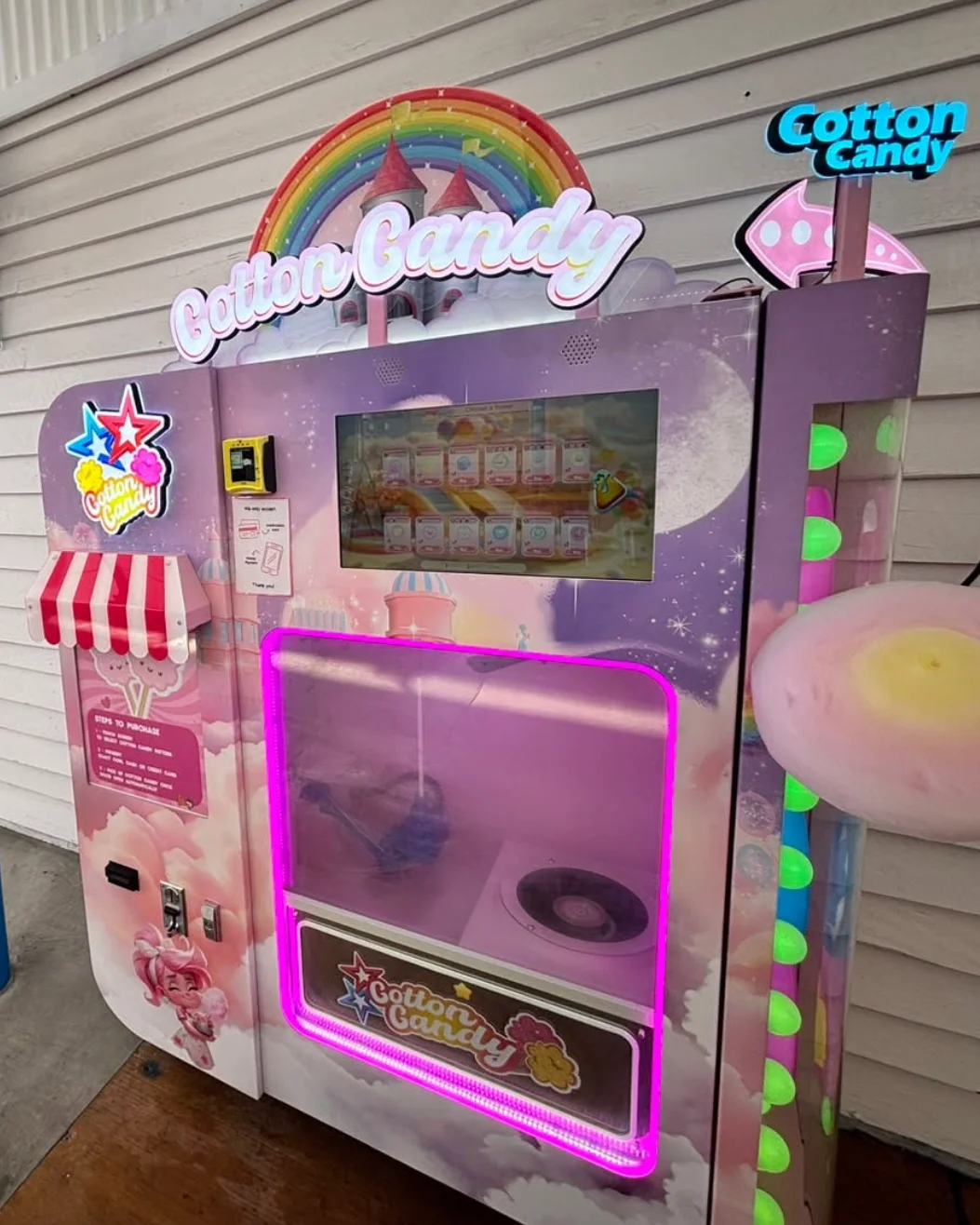 The full-size Flossed Fairy candy floss vending machine installed under cover, with fresh floss ready to collect