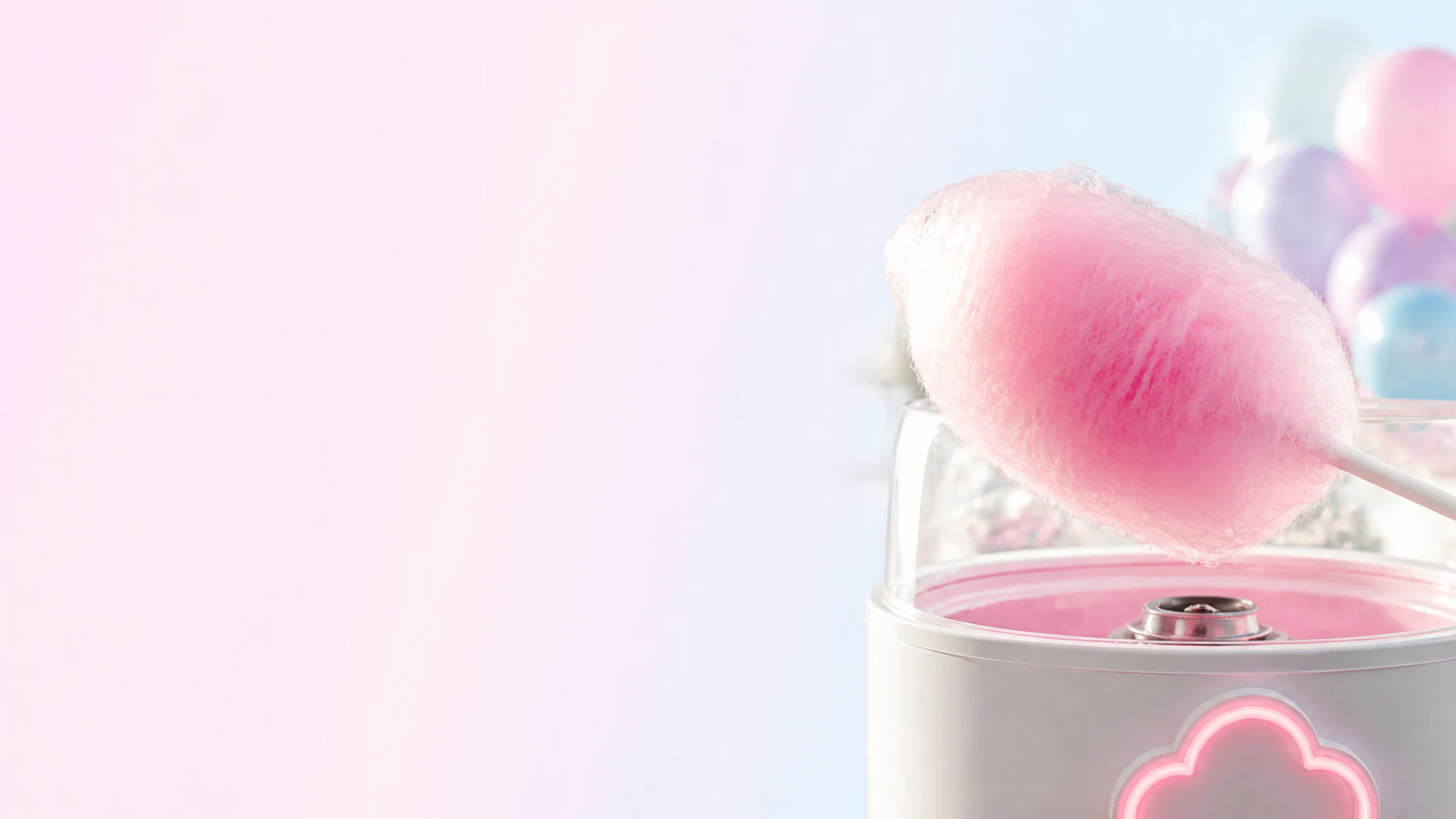 Fresh pink fairy floss on a stick, just spun by the Flossed Fairy machine